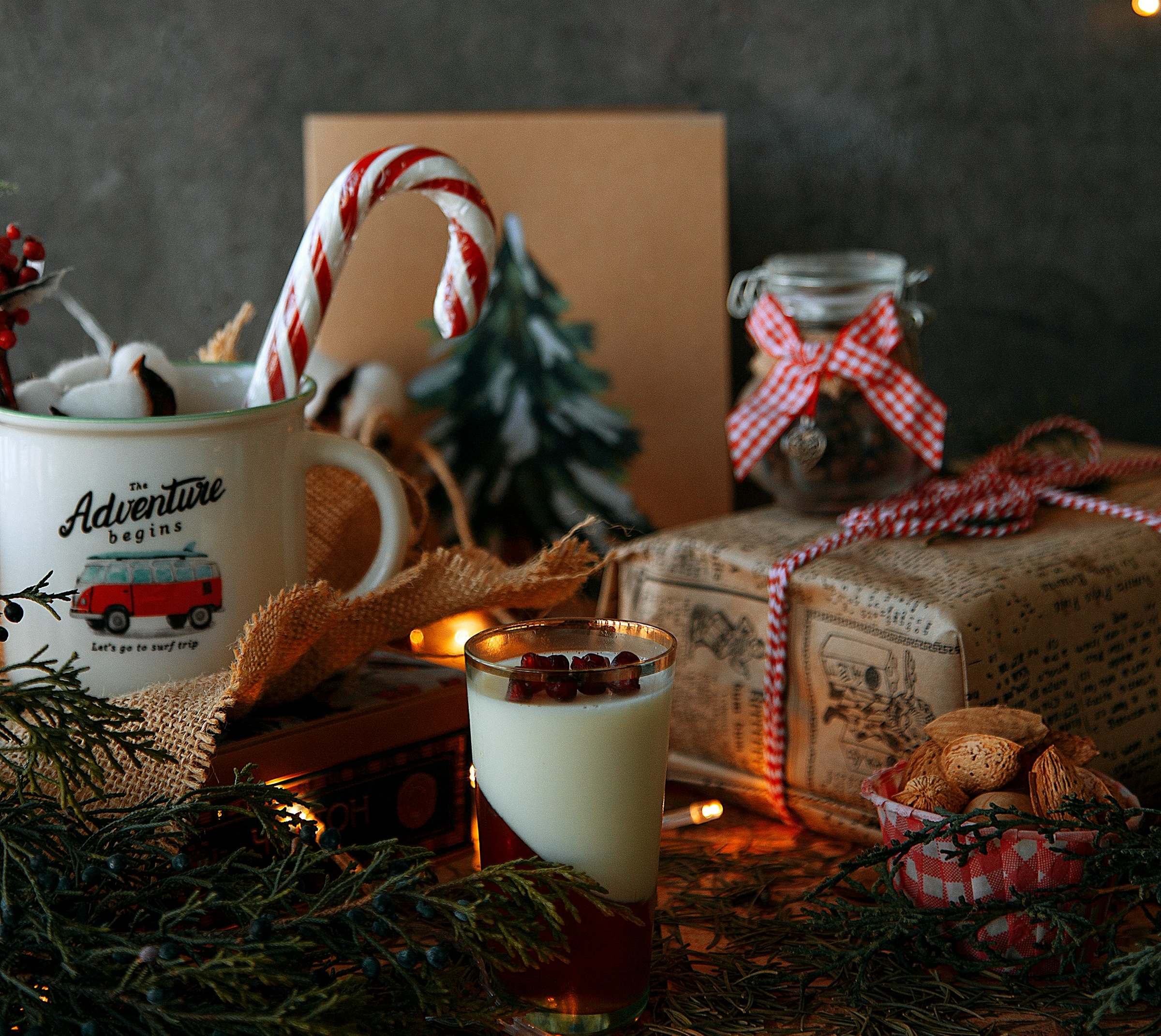 Holiday gift basket with cocoa, popcorn, and a Christmas candle