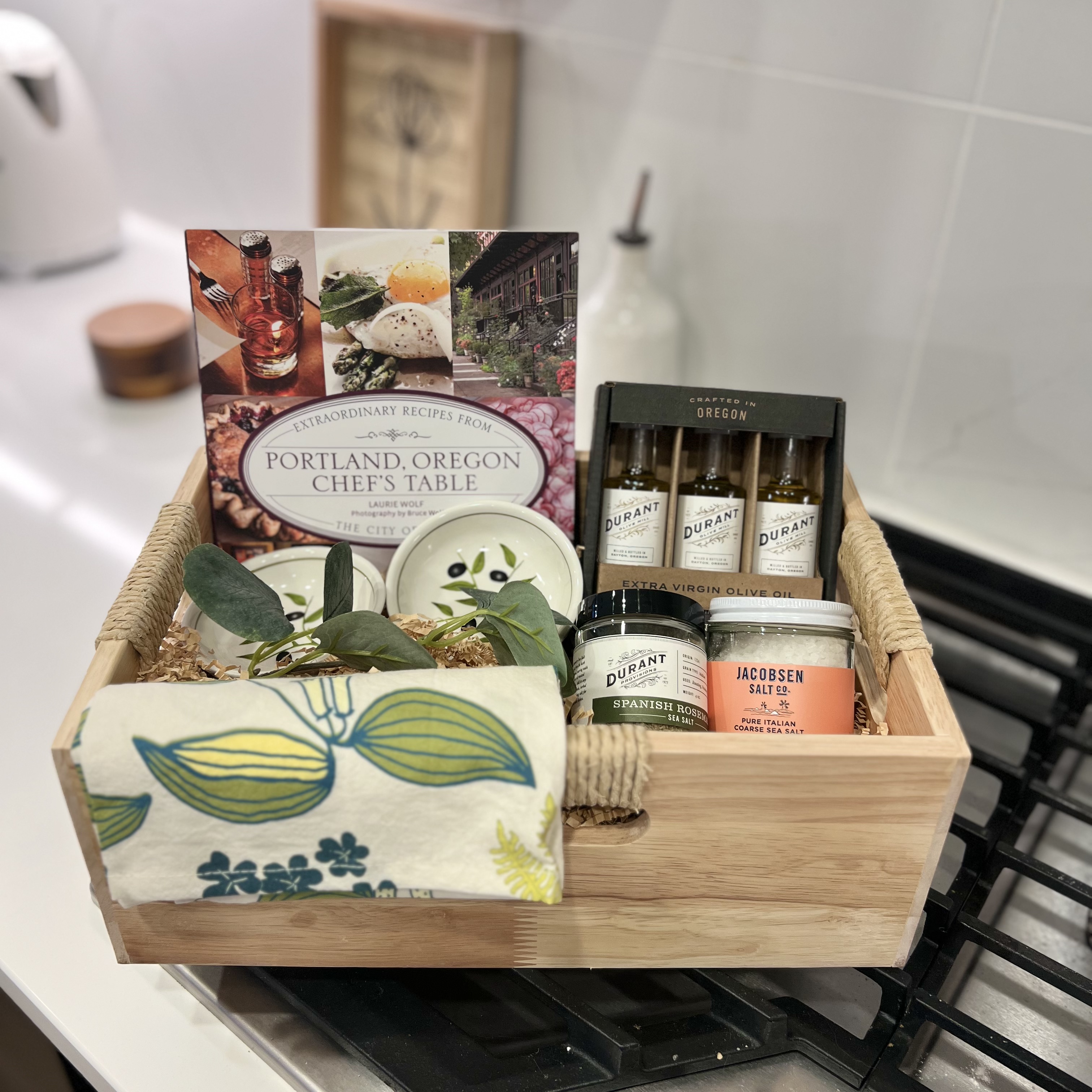 Chef Essentials gift basket with olive oil, sea salt, and cookbook