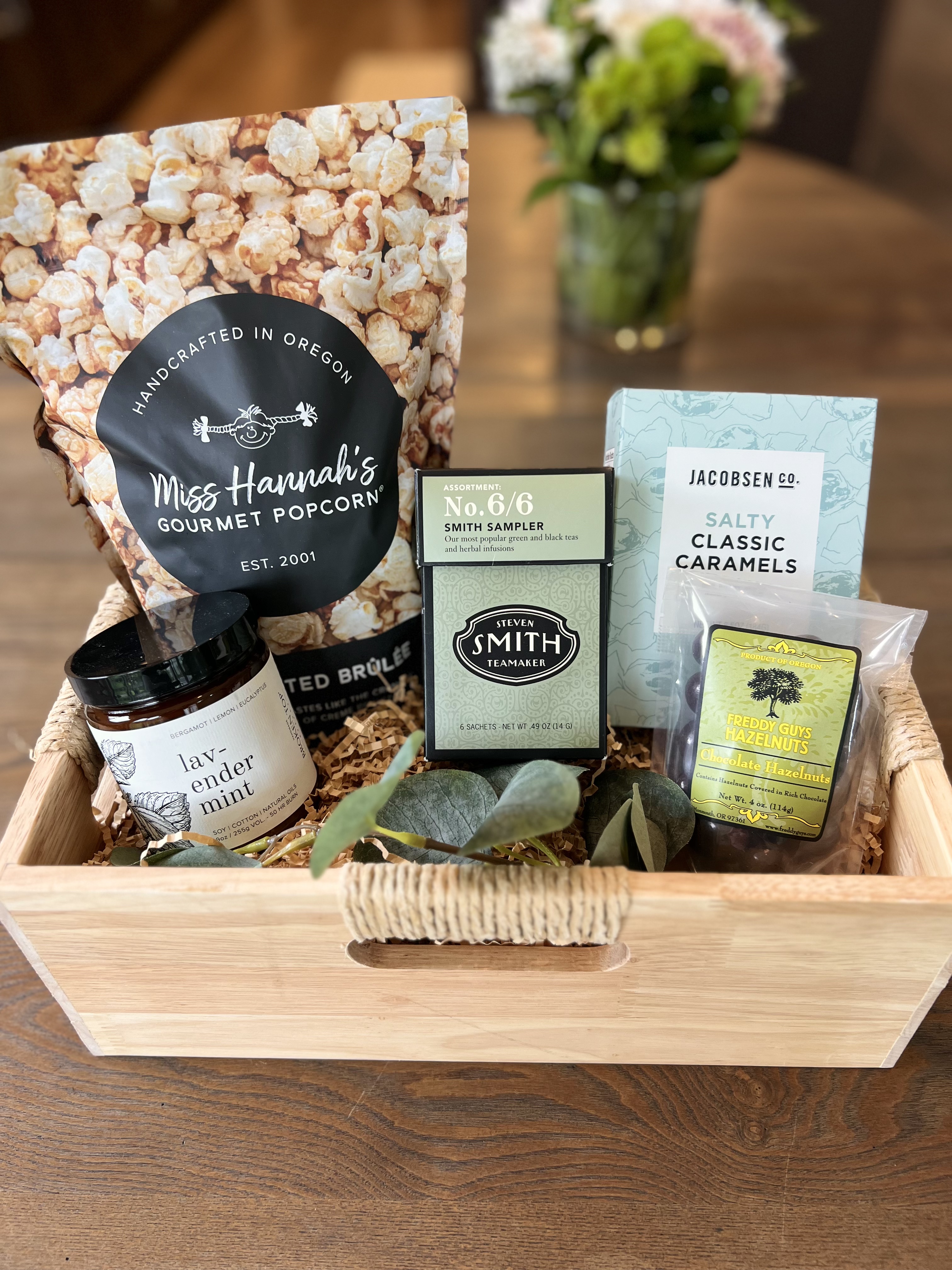 Sympathy gift basket with tea, candle, and comfort treats