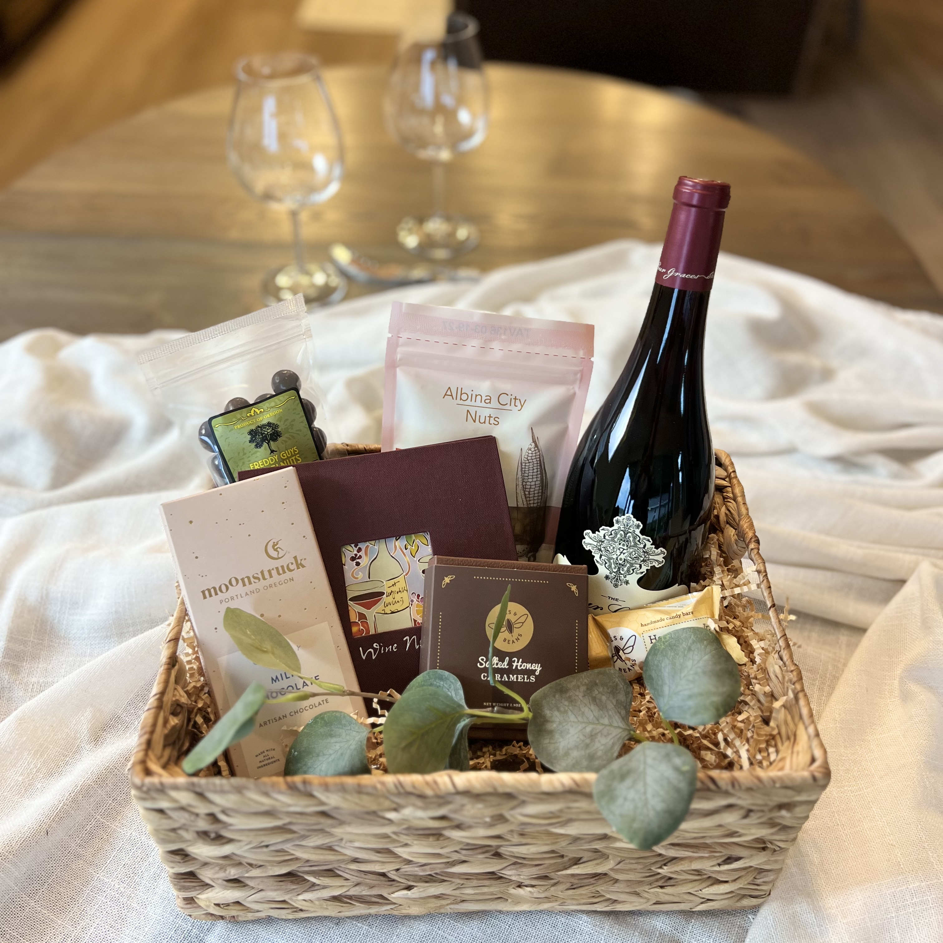 Uncork & Unwind gift basket with wine, chocolate, and nuts